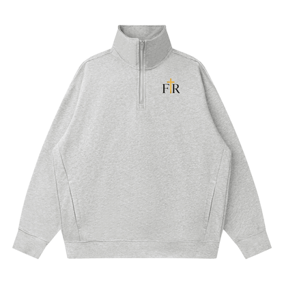 A light heather gray quarter-zip pullover sweatshirt with a small embroidered 'F&R' logo on the left chest, featuring a gold cross detail within the letter 'F'.