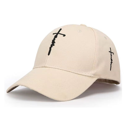 A beige baseball cap with black embroidered cross designs on the front and side, shown against a plain white background.