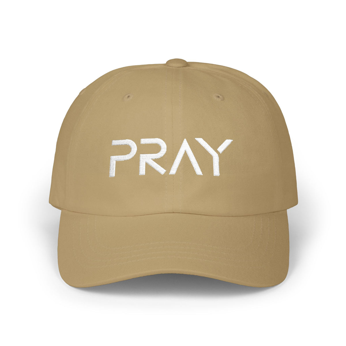 A tan baseball cap with the word 'PRAY' embroidered in white across the front, shown on a clean white background.